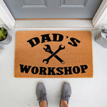 Dad's Workshop coir doormat featuring a wrench design, perfect for a garage or man cave entrance.