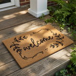 A decorative welcome mat with the word "welcome" written on it.