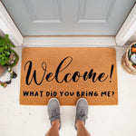 Funny Welcome Doormat with the text What Did You Bring Me, a natural coir fiber front porch rug for home entryways, featuring a humorous message for guests in a stylish script and bold font on a durable outdoor floor mat for your