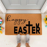 Happy Easter coir doormat with a cross and bunny ears design, featuring a natural fiber welcome mat for spring porch decor, placed at a front door with colorful eggs and yellow flowers for a festive seasonal home entrance look.