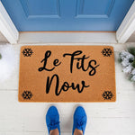 Winter snowflake doormat with funny holiday text on a natural coir welcome mat, featuring a festive seasonal design for your front porch decor that adds a humorous touch to your home entrance during the cold snowy winter months.