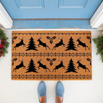 Christmas reindeer doormat with a festive pine tree and holly pattern on natural coir fiber, perfect for a holiday front porch welcome mat.