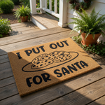 Funny Christmas doormat with a plate of cookies illustration and the text I PUT OUT FOR SANTA, this natural coir fiber welcome mat is a humorous holiday front porch decor piece for your home entrance during the winter festive