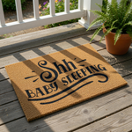 Shh Baby Sleeping doormat, a natural coir fiber welcome mat with black text for new parents.