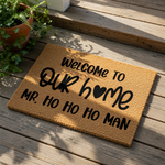 Christmas welcome doormat featuring natural coir fiber with black text that reads Welcome to our home Mr.