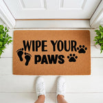 Wipe Your Paws doormat with human and animal footprints, a natural coir fiber welcome mat for pet lovers, featuring bold black text and paw prints on a durable outdoor rug for your front porch, entryway, or home entrance decor.
