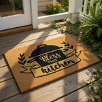 Bless This Kitchen coir doormat featuring a black cooking pot graphic and farmhouse style lettering, this natural fiber welcome mat is a durable floor rug for your home entryway, kitchen decor, or a housewarming front porch