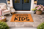 Funny Kids Welcome Doormat featuring a natural coir fiber texture and bold black text that reads Today's Chaos Sponsored By Our Kids, displayed on a stone porch entryway for a stylish home decor look that greets guests with humor.