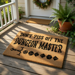 Funny Dungeon Master doormat featuring a sword and polyhedral dice icons, this natural coir welcome mat is a perfect gaming room decor piece for tabletop roleplaying fans who want a bold, humorous entrance for their home or game