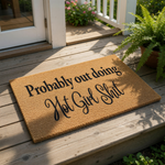 Funny coir doormat with the text Probably out doing Hot Girl Shit printed in black ink, this natural fiber welcome mat is a cheeky front porch decor piece for a modern home entrance or a stylish apartment entryway floor rug.