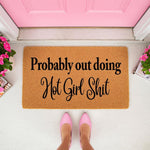 Funny doormat with the text Probably out doing Hot Girl Shit, a natural coir welcome mat for front porch decor.