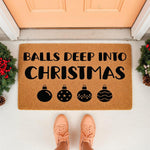 Funny Christmas doormat with bold black text and ornament icons on a natural coir fiber welcome mat, perfect for a festive front porch entry decor, featuring a humorous holiday saying for a cheeky seasonal home entrance floor rug.