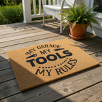 My Garage My Tools My Rules doormat featuring bold black text on a natural coir fiber welcome mat, perfect for a workshop or garage entrance as a funny floor rug for men who love DIY projects and home improvement garage decor.