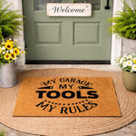 My Garage My Tools My Rules doormat, a funny coir welcome mat for a workshop or garage entrance, featuring bold black text on a natural fiber rug, perfect for a man cave, home shop, or garage decor gift for a handyman or tool
