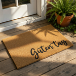 Guten Tag coir doormat with natural fiber texture and black script lettering, this durable outdoor welcome mat is a stylish front porch rug for home entryways, providing a functional and decorative floor covering for your house