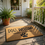 Dogs Welcome People Tolerated coir doormat with a black paw print design, this funny pet lover welcome mat is a durable natural fiber floor rug for your front porch entry that makes a humorous housewarming gift for dog owners.