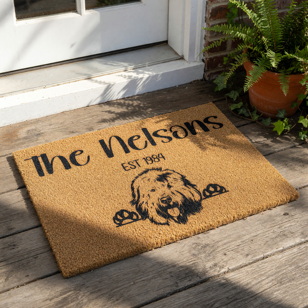 Personalized family name dog doormat featuring a cute shaggy dog illustration on natural coir fiber, this custom welcome mat for front porch decor makes a durable outdoor rug for pet lovers and dog owners to display at their home