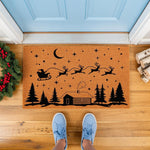 Christmas sleigh doormat featuring a flying reindeer silhouette and cabin scene on natural coir fiber.