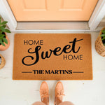 Personalized family name doormat featuring Home Sweet Home text on a natural coir fiber welcome mat, perfect for a front porch entryway decor update that adds a stylish and inviting touch to any house entrance for new homeowners.