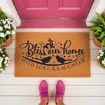 Bless Our Home doormat with love and laughter text and bird design, a natural coir fiber welcome mat for front porch decor that features a charming bird and floral motif on a durable outdoor rug for a cozy entryway housewarming
