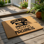 Sewing machine welcome doormat featuring a natural coir fiber texture and black printed text that reads Home is where the sewing machine is, making a fun entry rug for a craft room, sewing studio, or a hobbyist home entrance