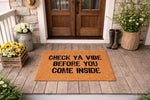 Funny Check Ya Vibe Before You Come Inside doormat for front porch decor, featuring bold black text on a natural coir fiber welcome mat that adds a humorous touch to your home entryway, housewarming gift, or outdoor floor mat