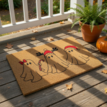Christmas ghost doormat featuring three cute ghosts wearing holiday hats and a red bow while holding a candy cane, this festive coir welcome mat is a fun seasonal home decor piece for your front porch during the winter holidays.