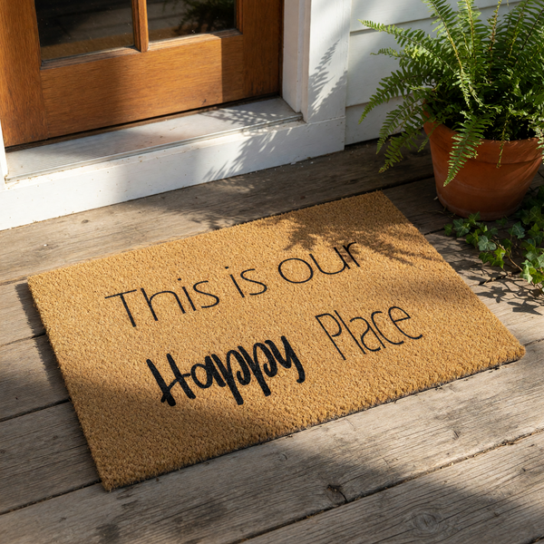 This is our Happy Place coir doormat features natural fiber construction with black text, making it a stylish welcome mat for your front porch, entryway, or home decor to greet guests with a warm and inviting message at your door.