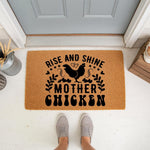 Rise and Shine Mother Chicken doormat featuring a black rooster graphic on a natural coir welcome mat, perfect for farmhouse porch decor or a funny housewarming entry rug for a chicken lover who enjoys rustic home accessories.