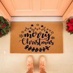 Merry Christmas doormat with festive holiday design, featuring black script text, stars, and snowflakes on a natural coir fiber welcome mat, placed on a porch entryway for seasonal home decor and winter front door decoration.