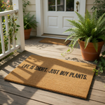 Life is short just buy plants coir doormat with natural fiber texture, featuring bold black text on a durable outdoor welcome mat for plant lovers, perfect for a front porch entry or housewarming decor for any home gardener.