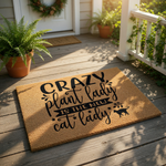 Crazy plant lady cat lady doormat for front porch, featuring a funny quote on natural coir fiber.