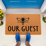 Bee welcome doormat with Our Guest text, a natural fiber coir mat for front porch decor.