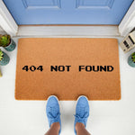 Funny 404 Not Found doormat for tech lovers, featuring a pixelated computer error message on a natural coir fiber welcome mat, perfect for a front porch entrance or a geeky home decor gift for programmers and software developers.