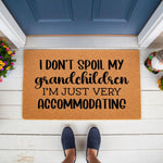 Grandparent doormat with funny quote I don't spoil my grandchildren I'm just very accommodating, featuring natural coir fiber material for a front porch welcome mat that makes a humorous gift for Grandma, Nana, or Grandpa at the