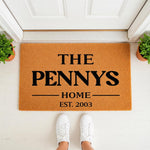 Personalized family name doormat featuring custom text on a durable coir welcome mat, perfect for a front porch entryway decor update, showing a stylish housewarming floor rug with a clean modern design for your home entrance.