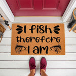 Fishing themed welcome doormat with I fish therefore I am text and fish illustrations, placed on a white porch floor in front of a red door, perfect for outdoor entryways and home decor for anglers who love fishing hobby