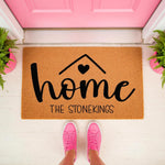 Personalized family name doormat featuring a home design with a heart icon, this natural coir welcome mat is a custom front porch rug for housewarming decor that adds a stylish touch to any entryway or home entrance for new