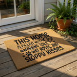 Dog lover coir doormat featuring the text This Home Is Filled With Wagging Tails, Wet Noses, And Sloppy Kisses with paw print icons, a durable natural fiber welcome mat for pet owners and dog house decor for your front porch