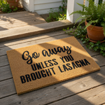 Funny Go Away Unless You Brought Lasagna coir doormat for front porch entry, featuring bold black text on a natural brown fiber welcome mat that serves as a humorous housewarming decor piece for food lovers and home entrance.