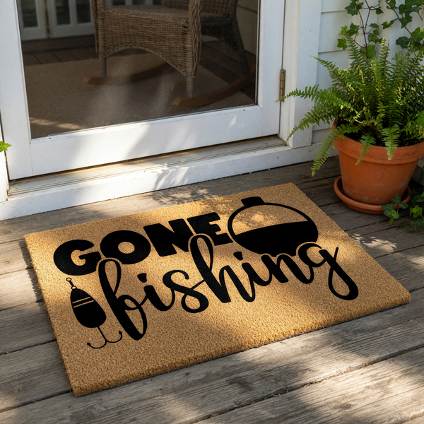 Gone Fishing coir doormat featuring a black printed fishing bobber and hook design on a natural fiber welcome mat, perfect for a front porch or outdoor entryway for any fisherman or outdoor enthusiast looking for home decor.