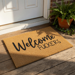 Funny Welcome Fuckers doormat made of natural coir fiber with a durable backing, featuring bold black typography for a rude front porch rug or entryway mat that adds a humorous touch to your home decor and outdoor entrance.