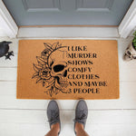 Funny skull doormat with floral design and text about murder shows and comfy clothes, this natural coir welcome mat is a sarcastic front porch decor piece for true crime fans who enjoy dark humor and gothic home entryway