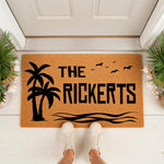 Personalized tropical palm tree doormat for front porch entry, featuring a custom family name design with ocean waves and birds on natural coir fiber, creating a stylish coastal welcome mat for your home entrance and outdoor