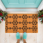 Winter snowflake doormat with a natural coir fiber texture and black holiday pattern, featuring a festive seasonal welcome mat design for your front porch decor, perfect for Christmas entryway styling and winter home floor mats.