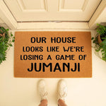 Funny welcome doormat with a humorous quote about a messy house, featuring durable natural coir fiber material for a front porch entrance, perfect for a housewarming gift or a fun home decor accent for any entryway or front door.