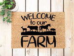 Farm animal welcome doormat featuring a goat, cow, horse, and pig silhouette design on natural coir fiber, perfect for a rustic farmhouse porch entrance or outdoor entryway decor for animal lovers and country home enthusiasts.