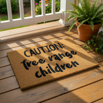 Funny free range children doormat with bold black text on a natural coir fiber mat, this humorous outdoor welcome mat is a durable front porch rug that makes a playful statement for any family home entrance or entryway decor.