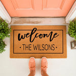 Personalized family name welcome doormat featuring a classic black border and script text on natural coir fiber, perfect for a front porch entryway decor update that adds a custom touch to your home entrance and housewarming gift