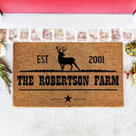 Personalized deer farm doormat with a rustic outdoor welcome mat design, featuring a black stag silhouette, established year, and custom family name text on natural coir fiber, perfect for a farmhouse porch or front door entrance